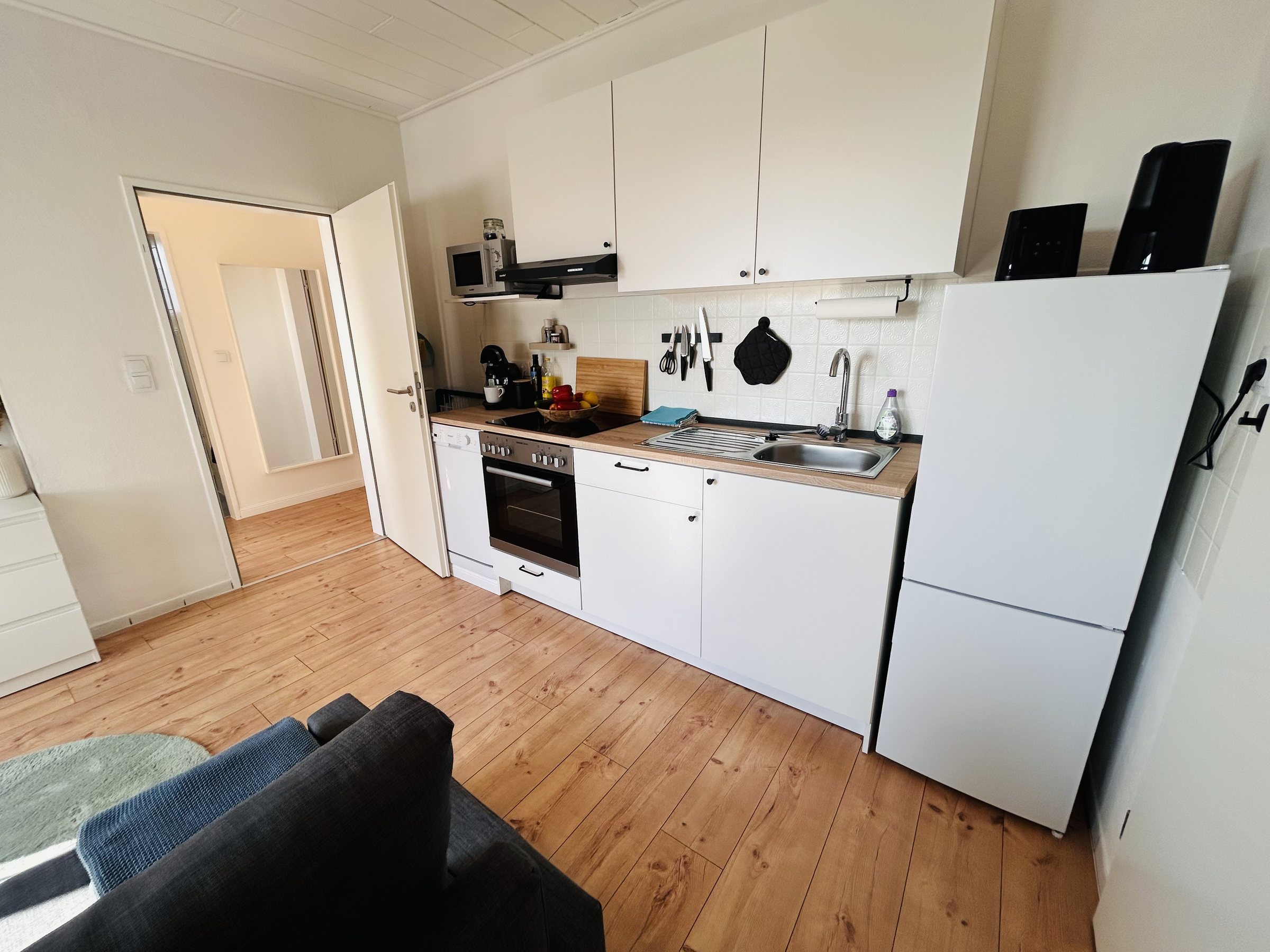 Küche und Wohnbereich in Ferienwohnung 1